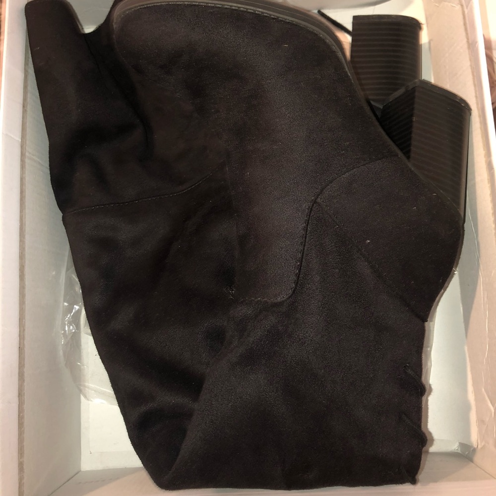 Thigh high black suede heeled boots